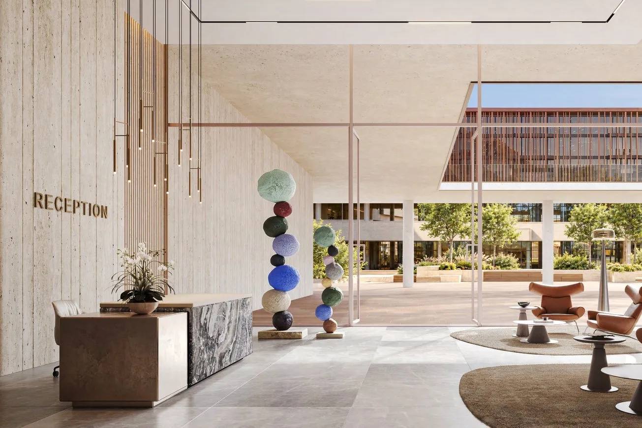 Reception lobby with stone walls, marble desk, pendant lights and sculpture