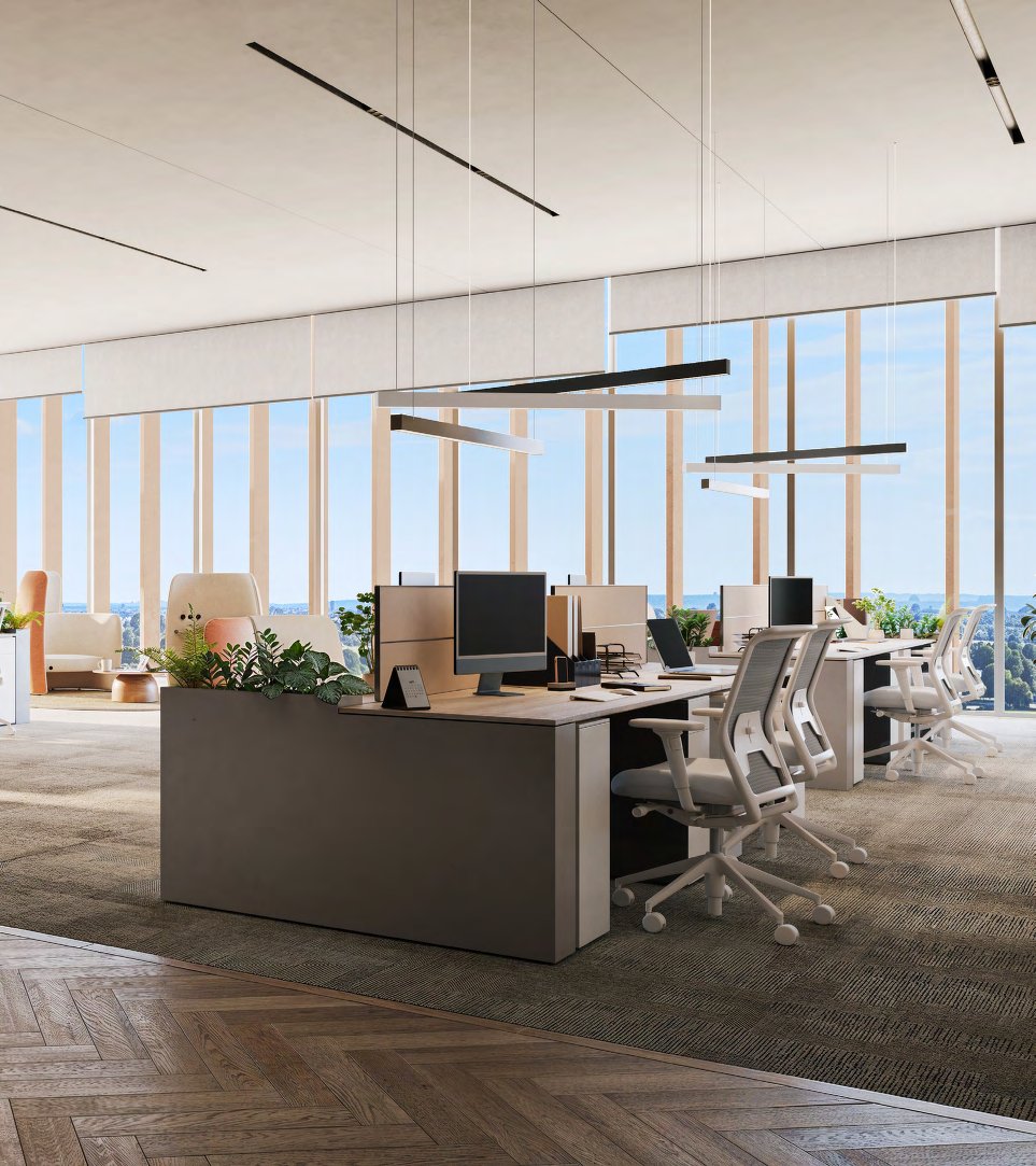 Open-plan office with desks and floor-to-ceiling windows