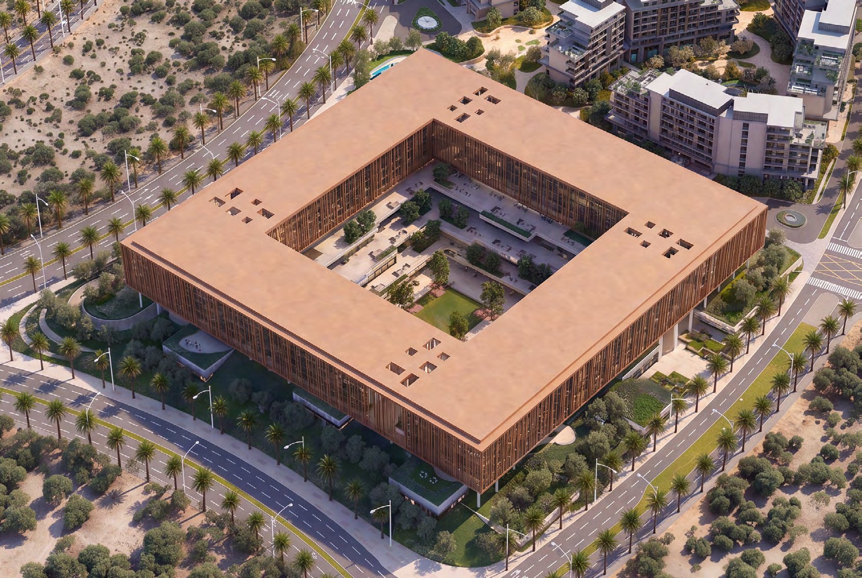 Aerial view of the square office complex among palm-lined roads and homes