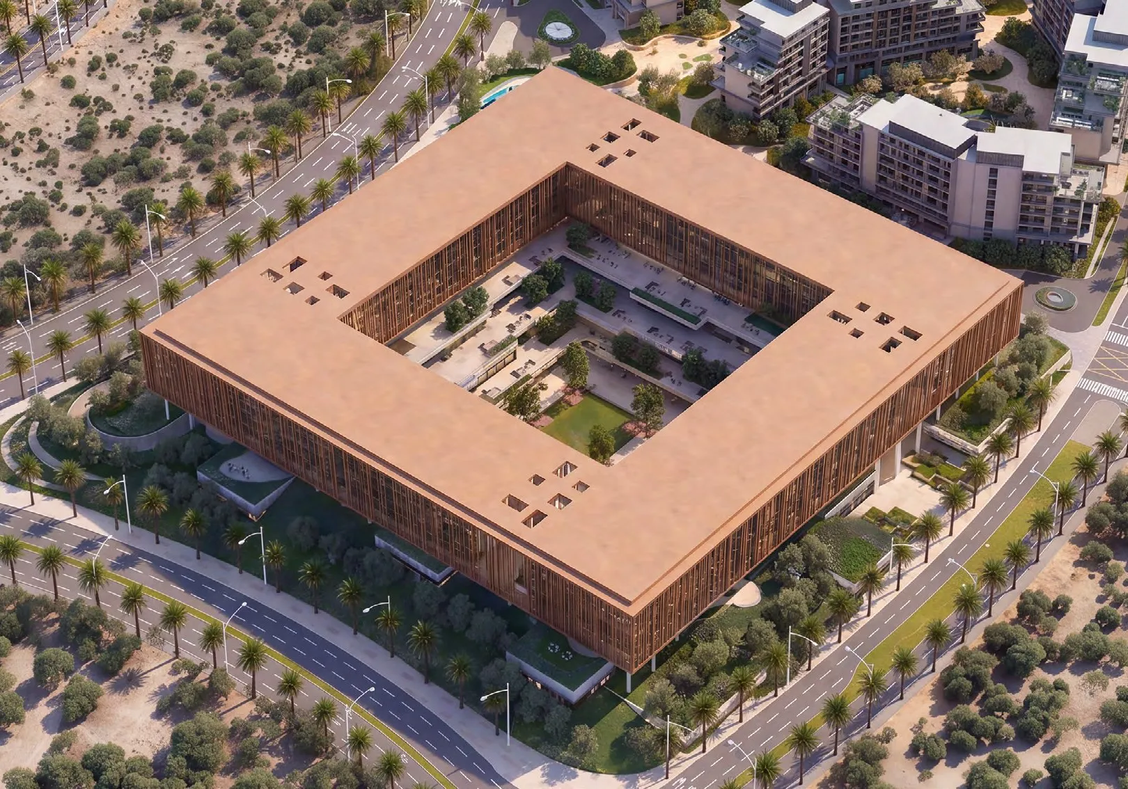 Aerial view of the square office complex among palm-lined roads and homes