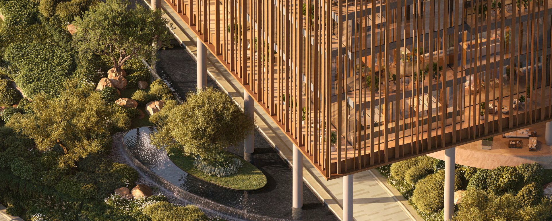 Louvred office block raised on columns over gardens and a water feature